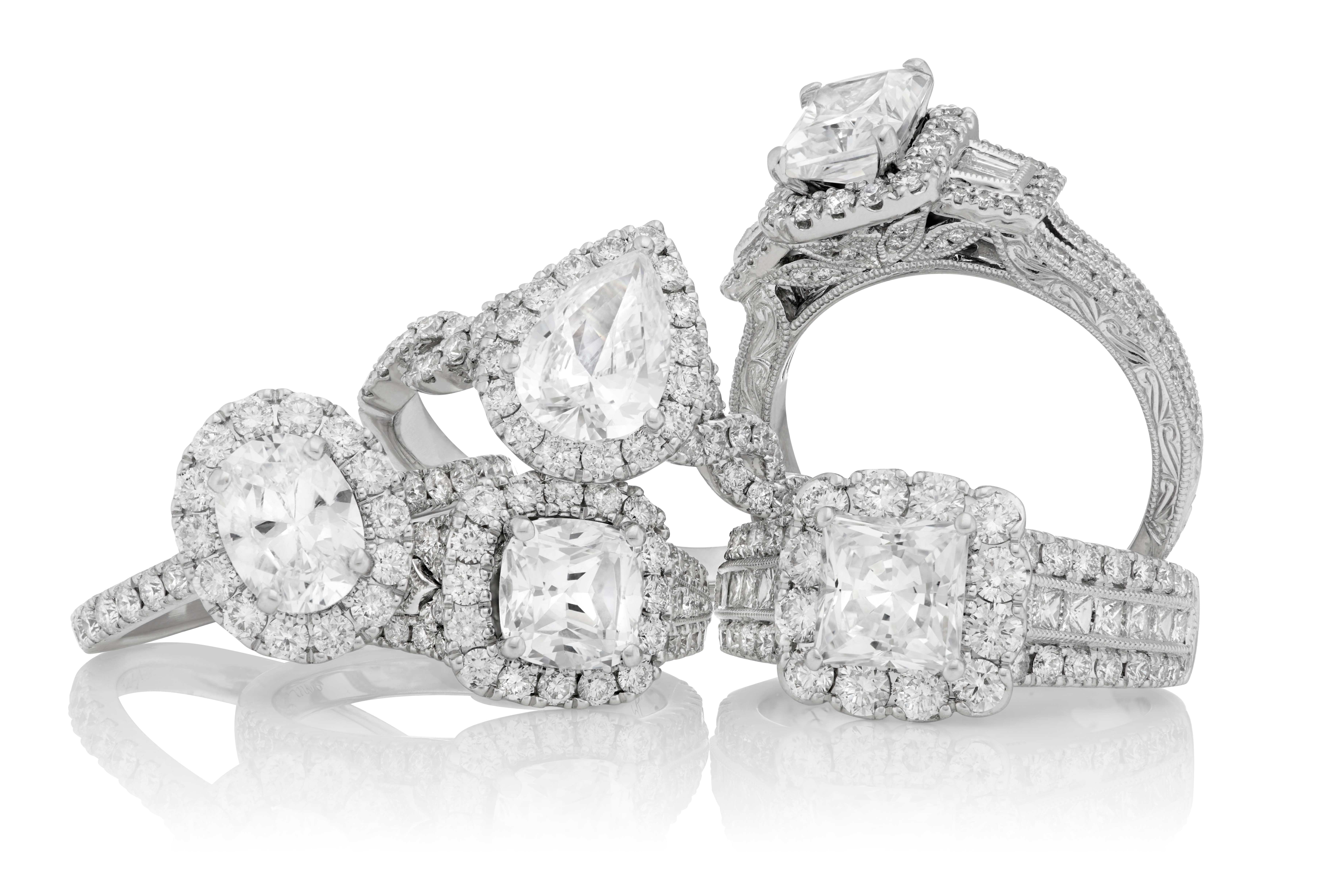 Diamond bridal engagement rings collection featuring various cuts including oval, pear, cushion, and emerald diamonds in halo and pavé settings